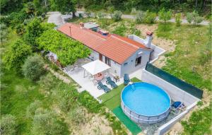 an aerial view of a house with a swimming pool at 2 Bedroom Cozy Home In Kostrcani in Kostrčani