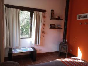 Giường trong phòng chung tại Casa Del Valle Traslasierra