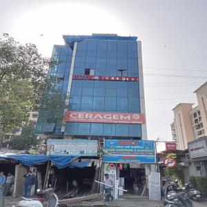 a tall building with a store in front of it at Hotel New Sarah Inn, Andheri West in Mumbai