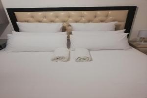 En eller flere senge i et værelse på Maluti Backpackers