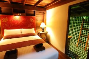 Ein Bett oder Betten in einem Zimmer der Unterkunft Leeloo Paradise