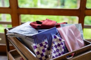 a box full of ties sitting on a table at Yunoshimakan in Gero