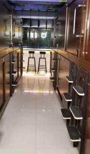 a row of stools in an empty locker room at Sleep Cubee Hostel in Hong Kong