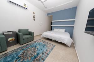 Postel nebo postele na pokoji v ubytování استراحة نادي اورجان Orjan Guest House