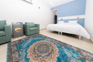 מיטה או מיטות בחדר ב-استراحة نادي اورجان Orjan Guest House