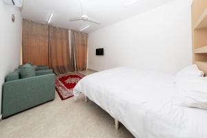 Postel nebo postele na pokoji v ubytování استراحة نادي اورجان Orjan Guest House