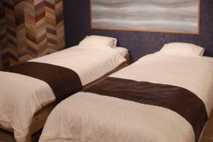 MolinHotels201温泉付き別荘 -アクティビティを満喫できる札幌定山渓-2LDK W-beds2&S-beds4客房内的一张或多张床位