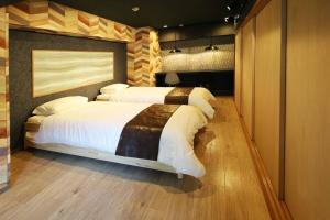 MolinHotels201温泉付き別荘 -アクティビティを満喫できる札幌定山渓-2LDK W-beds2&S-beds4客房内的一张或多张床位