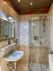 a bathroom with a shower and a sink at B&B Domus de Janas Gonnesa in Gonnesa