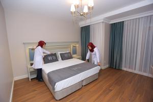 Postel nebo postele na pokoji v ubytování HaciBayramHotel
