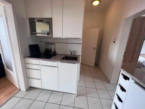 Kuchyň nebo kuchyňský kout v ubytování Nordland Appartements - Wohnung Sylt
