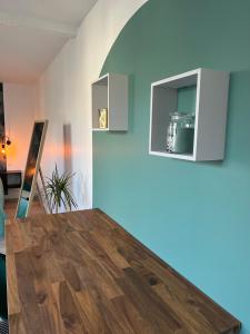 a dining room with a wooden table in a room at YellowHouse - CosyHouseByJanna in Châtellerault