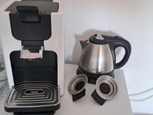 a coffee maker and a tea kettle on a counter at Airbnb Meppel Centrum in Meppel +17 photos