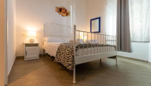 Una cama o camas en una habitación de Vercelli Guest House near San Giovanni