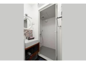 a bathroom with a shower and a sink at OAK Yasaka / Vacation STAY 477 in Osaka