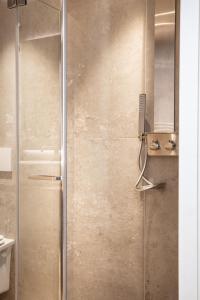 a shower with a glass door in a bathroom at Agriturismo Maria Vittoria in Custoza