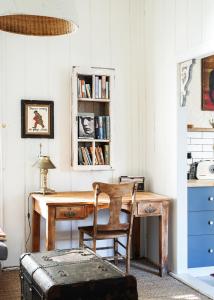 an office with a wooden desk and a chair at Mill Cottage in Tenterfield