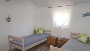 Postel nebo postele na pokoji v ubytování Apartment Lavanda with three bedrooms - TA Leut Agency