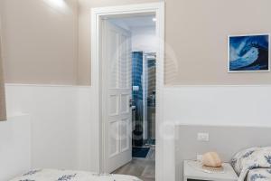 A bed or beds in a room at Villa Sabbia Bianca By Cala Salento