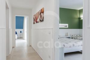 A bed or beds in a room at Villa Sabbia Bianca By Cala Salento
