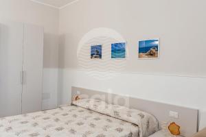 A bed or beds in a room at Villa Sabbia Bianca By Cala Salento