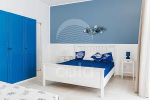 A bed or beds in a room at Villa Sabbia Bianca By Cala Salento