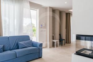 A seating area at Villa Sabbia Bianca By Cala Salento
