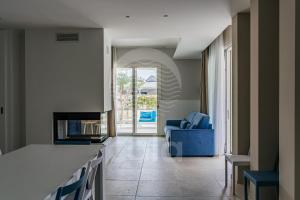 A seating area at Villa Sabbia Bianca By Cala Salento