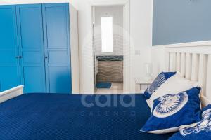 A bed or beds in a room at Villa Sabbia Bianca By Cala Salento
