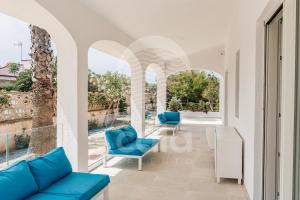 A seating area at Villa Sabbia Bianca By Cala Salento