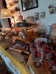 a table with wine glasses and bread on it at Agriturismo Villa Greggio in Casalserugo