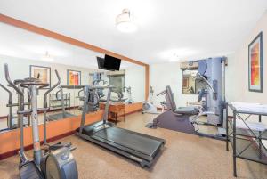 a gym with treadmills and ellipticals in a room at Baymont by Wyndham Springfield South Hwy 65 in Springfield