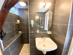 a bathroom with a sink and a mirror at Flinder Amsterdam in Amsterdam +16 photos