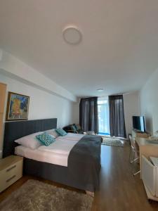 Postel nebo postele na pokoji v ubytování garni Hotel S.O.G.* * *