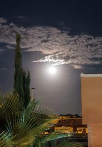 a full moon in the sky at night at Villa Preciosa in Camposol