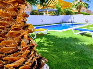 a resort with a pool and a bunch of seafood at Villa Preciosa in Camposol