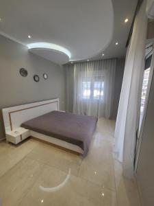 Posteľ alebo postele v izbe v ubytovaní Kavala silver apartment