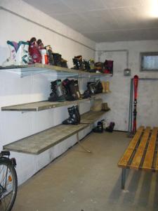 a room with shelves with shoes and a bike in it at Katschberghöhe 21 in Katschberghöhe