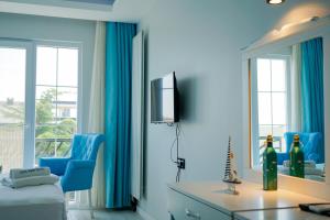 Μια τηλεόραση ή/και κέντρο ψυχαγωγίας στο NOVA PORT Boutique Hotel