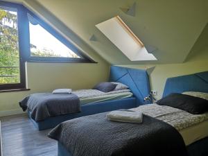 Posteľ alebo postele v izbe v ubytovaní Apartamenty Tatrzańskie Turnie Krupówki