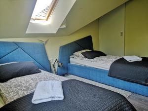 Posteľ alebo postele v izbe v ubytovaní Apartamenty Tatrzańskie Turnie Krupówki