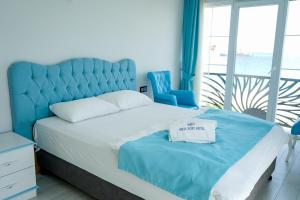Ένα ή περισσότερα κρεβάτια σε δωμάτιο στο NOVA PORT Boutique Hotel