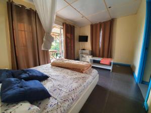 Postel nebo postele na pokoji v ubytování La Cabane D Eté