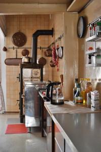 a kitchen with a stove and a counter top at Palazzetto Scodellari in San Vito al Tagliamento