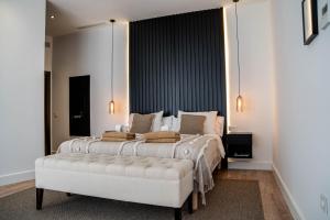 a bedroom with a large bed and a large window at Casa Bodhi Boutique Hotel & Spa in Marbella