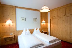 Postel nebo postele na pokoji v ubytování Hotel Grafenwirt