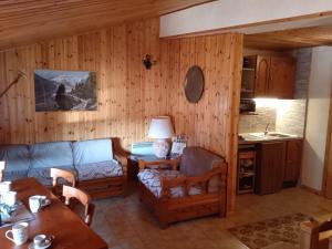a living room with a couch and a table at La Tua Casa a Roccaraso in Roccaraso