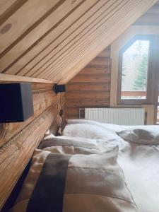 מיטה או מיטות בחדר ב-Voronins Retreat House