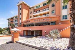 a building with a sign that reads entrance piscadia at The Beach Penthouse in Willemstad