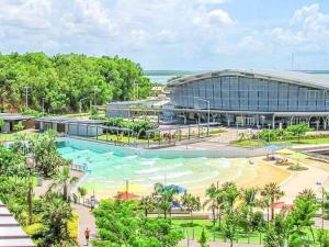 an image of a resort with a swimming pool at ZEN PARADISE - 2-BR Waterfront Ocean View Retreat in Darwin